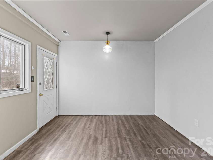 117 Robinson Avenue, Matthews, NC 28104.  MLS# CAR4388191, YatesRealty ID 30314. Breezeway