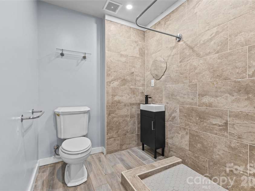 117 Robinson Avenue, Matthews, NC 28104.  MLS# CAR4388191, YatesRealty ID 30314. GuestBathroom