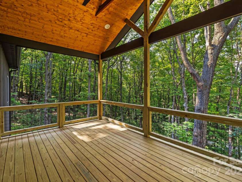 939 Rocky Mountain Road, Lake Toxaway, NC 28747.  MLS# CAR4279855, YatesRealty ID 30318. Covered back deck