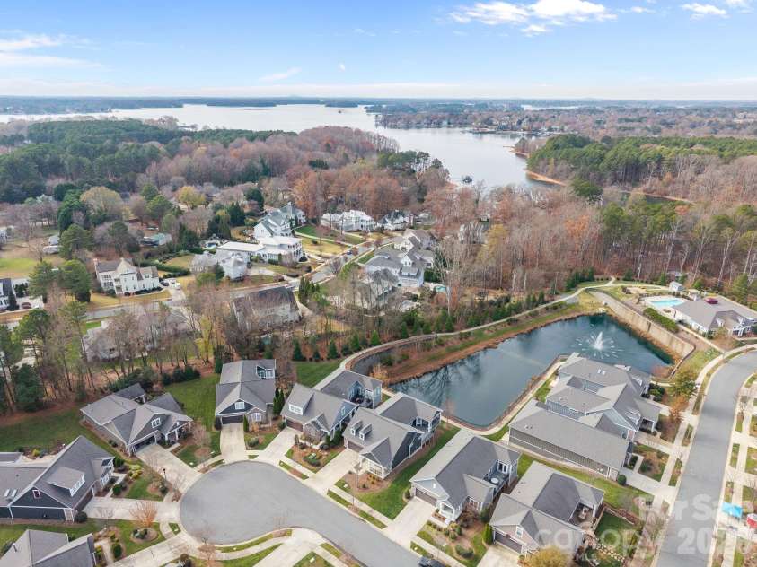15012 Courtside Cove Lane, Cornelius, NC 28031.  MLS# CAR4326155, YatesRealty ID 30321. Aerial view of pond, Lake, behind cul-de-sac