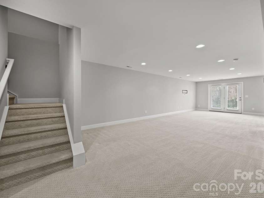 15012 Courtside Cove Lane, Cornelius, NC 28031.  MLS# CAR4326155, YatesRealty ID 30321. Finished basement den area