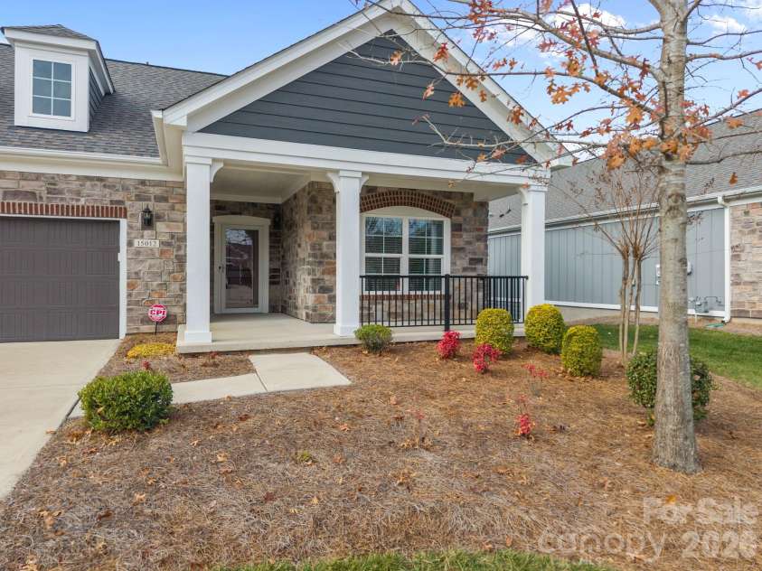 15012 Courtside Cove Lane, Cornelius, NC 28031.  MLS# CAR4326155, YatesRealty ID 30321. Front house with porch