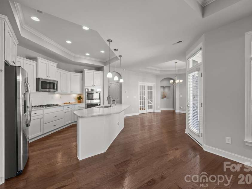 15012 Courtside Cove Lane, Cornelius, NC 28031.  MLS# CAR4326155, YatesRealty ID 30321. Kitchen and dining room view