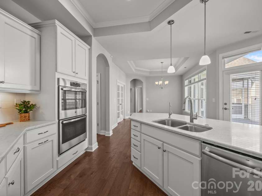 15012 Courtside Cove Lane, Cornelius, NC 28031.  MLS# CAR4326155, YatesRealty ID 30321. Kitchen view - double ovens