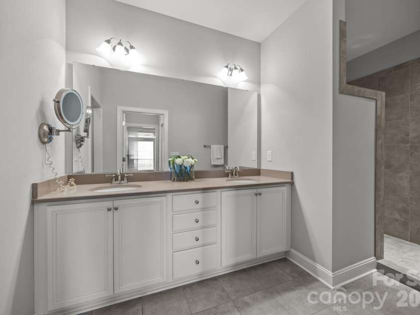 15012 Courtside Cove Lane, Cornelius, NC 28031.  MLS# CAR4326155, YatesRealty ID 30321. Primary bathroom two sinks