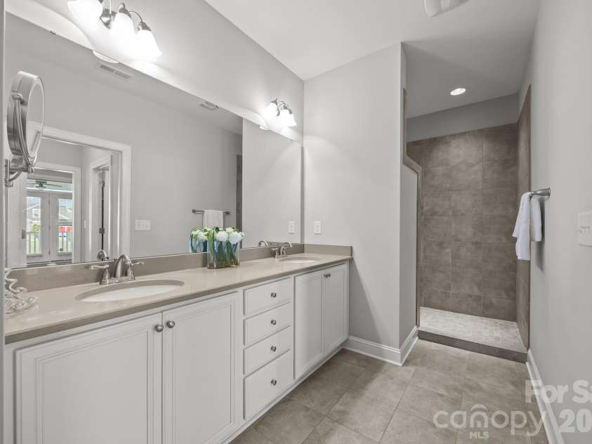 15012 Courtside Cove Lane, Cornelius, NC 28031.  MLS# CAR4326155, YatesRealty ID 30321. Primary bathroom with walk-in shower
