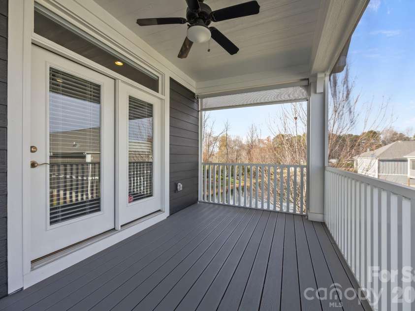 15012 Courtside Cove Lane, Cornelius, NC 28031.  MLS# CAR4326155, YatesRealty ID 30321. Screened in deck (underneath too) and electric shade