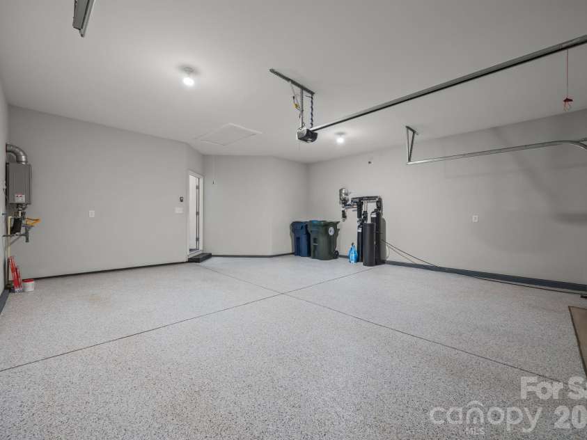 15012 Courtside Cove Lane, Cornelius, NC 28031.  MLS# CAR4326155, YatesRealty ID 30321. Two car garage expoxy flooring