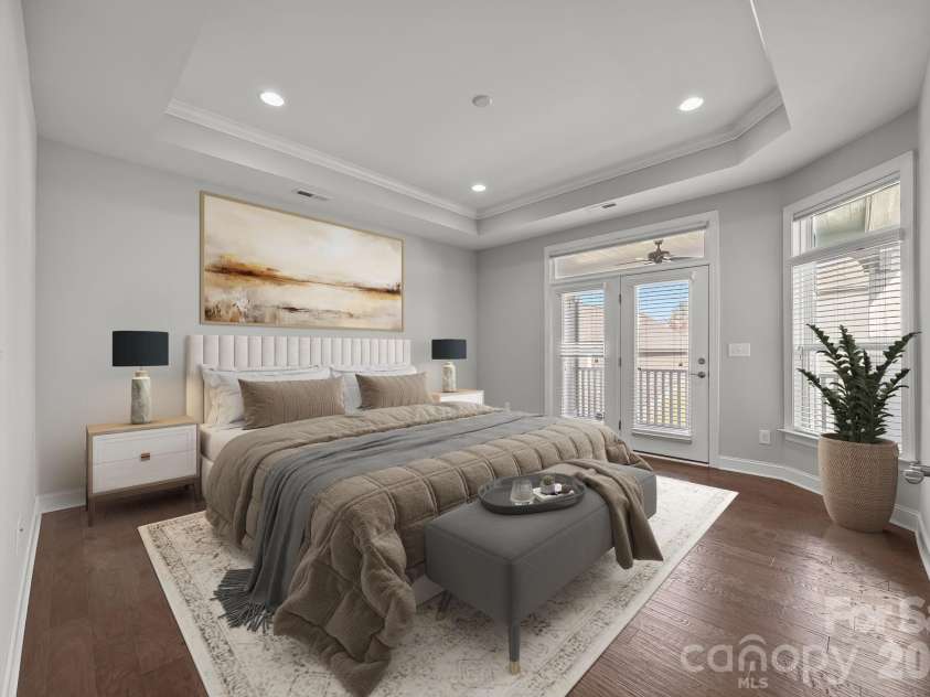 15012 Courtside Cove Lane, Cornelius, NC 28031.  MLS# CAR4326155, YatesRealty ID 30321. Virtually staged primary bedroom on main