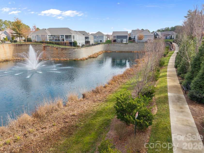15012 Courtside Cove Lane, Cornelius, NC 28031.  MLS# CAR4326155, YatesRealty ID 30321. Walking path around pond
