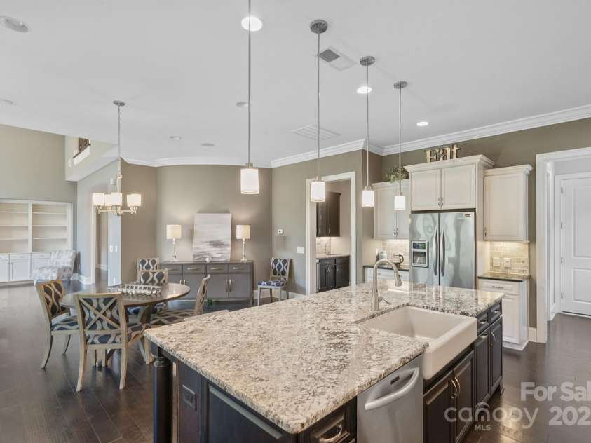 426 Kirkbride Court, Fort Mill, SC 29715.  MLS# CAR4270139, YatesRealty ID 30322. Farm sink on island w/pendant lights