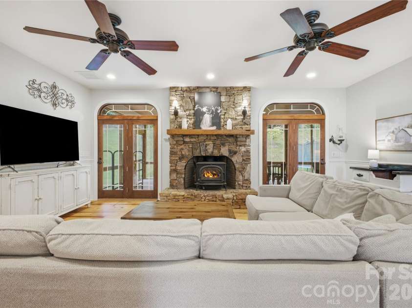 227 Black Bear Cove, Clyde, NC 28721.  MLS# CAR4393191, YatesRealty ID 30326. Family Room with stone Fireplace