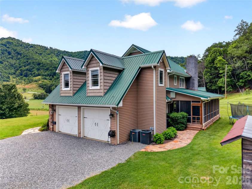 227 Black Bear Cove, Clyde, NC 28721.  MLS# CAR4393191, YatesRealty ID 30326. Garage and back screen porch view