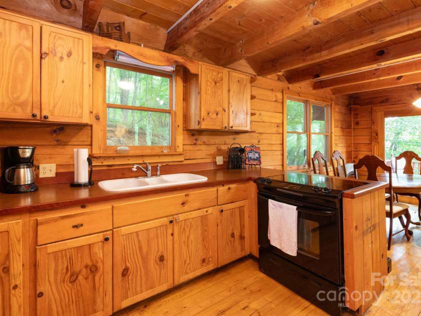 192 Granny Shepherd Road, Mars Hill, NC 28754.  MLS# CAR4285512, YatesRealty ID 3033. Kitchen open to dining area. Great flow for family meals or entertaining.