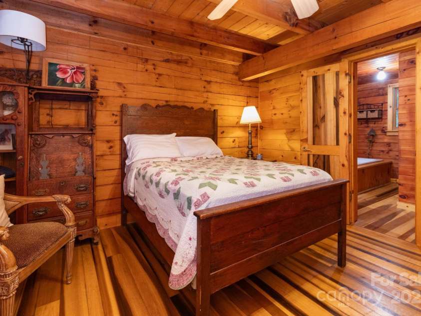 192 Granny Shepherd Road, Mars Hill, NC 28754.  MLS# CAR4285512, YatesRealty ID 3033. Main level primary bedroom with en suite and/or guest bath.