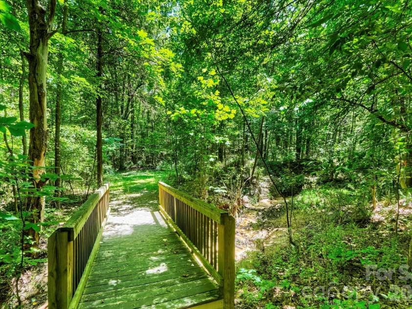 5925 Gatekeeper Lane, Mint Hill, NC 28227.  MLS# CAR4388583, YatesRealty ID 30338. Walking trail behind the house