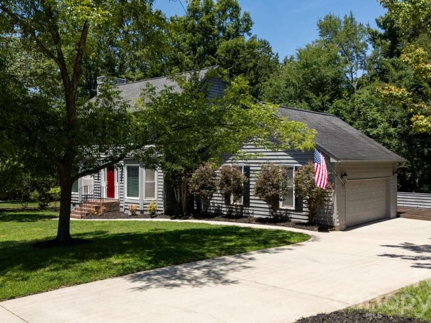 25012 Molokai Drive, Fort Mill, SC 29708.  MLS# CAR4393174, YatesRealty ID 30339. Front showing side entry garage