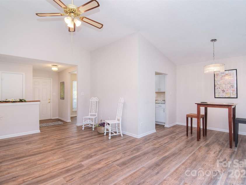 9034 Mcalpine Cove Court, Charlotte, NC 28270.  MLS# CAR4289074, YatesRealty ID 30347. Great room and dining area