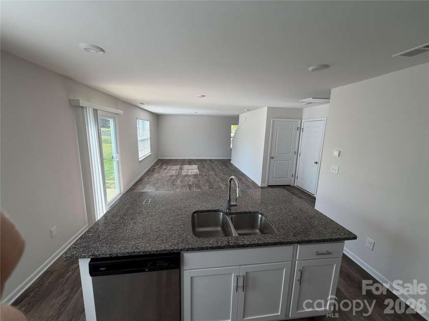 7868 Whispering Stream Drive, Sherrills Ford, NC 28673.  MLS# CAR4380726, YatesRealty ID 30352. Kitchen facing living room