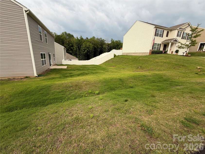 7868 Whispering Stream Drive, Sherrills Ford, NC 28673.  MLS# CAR4380726, YatesRealty ID 30352. Nice big lot on corner, side yard and also nice back yard,