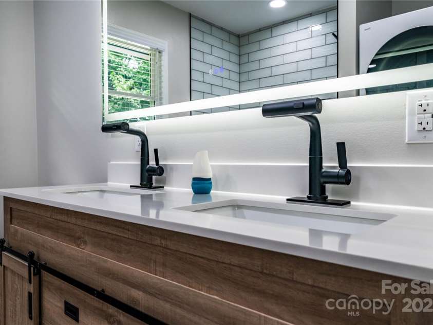 305 Linden Circle, Gastonia, NC 28054.  MLS# CAR4276624, YatesRealty ID 30355. Double-sink vanity and smart mirror for added convenience