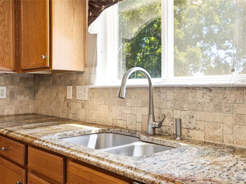 13310 Pontchatrain Avenue, Charlotte, NC 28273.  MLS# CAR4377198, YatesRealty ID 30358. Beautiful backsplas compliments the granite