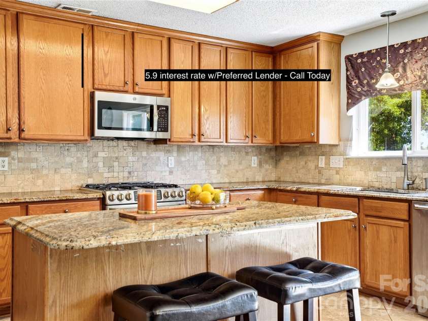 13310 Pontchatrain Avenue, Charlotte, NC 28273.  MLS# CAR4377198, YatesRealty ID 30358. Large granite ildand