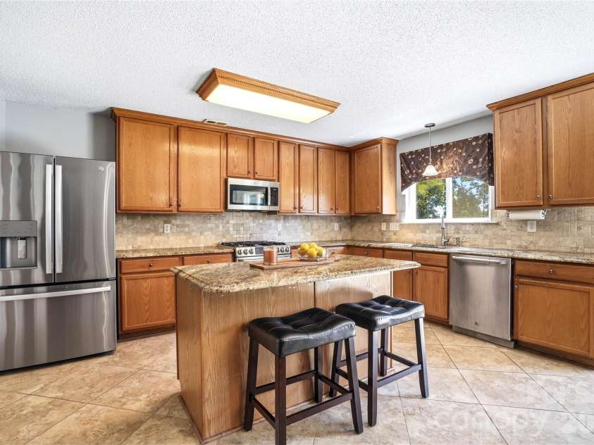 13310 Pontchatrain Avenue, Charlotte, NC 28273.  MLS# CAR4377198, YatesRealty ID 30358. Stunning kitchen with backsplash and larg island