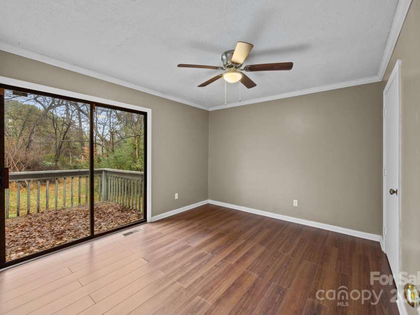 1158 Sunset Court, Conover, NC 28613.  MLS# CAR4328975, YatesRealty ID 3036. Primary Bedroom w/ Sliding Door to Back Deck