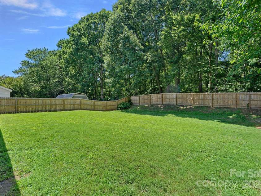 10415 Danesway Lane, Cornelius, NC 28031.  MLS# CAR4284118, YatesRealty ID 30361. Large Level Fenced Backyard