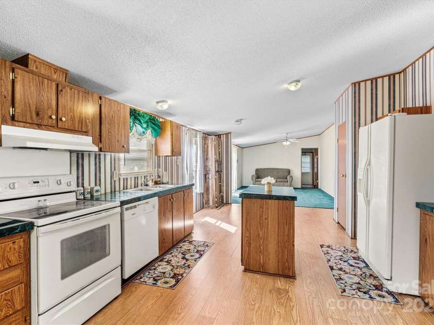 2800 Brushwood Circle, Newton, NC 28658.  MLS# CAR4288280, YatesRealty ID 30364. Open Concept/Kitchen/Family Room View (New Laminate Flooring)