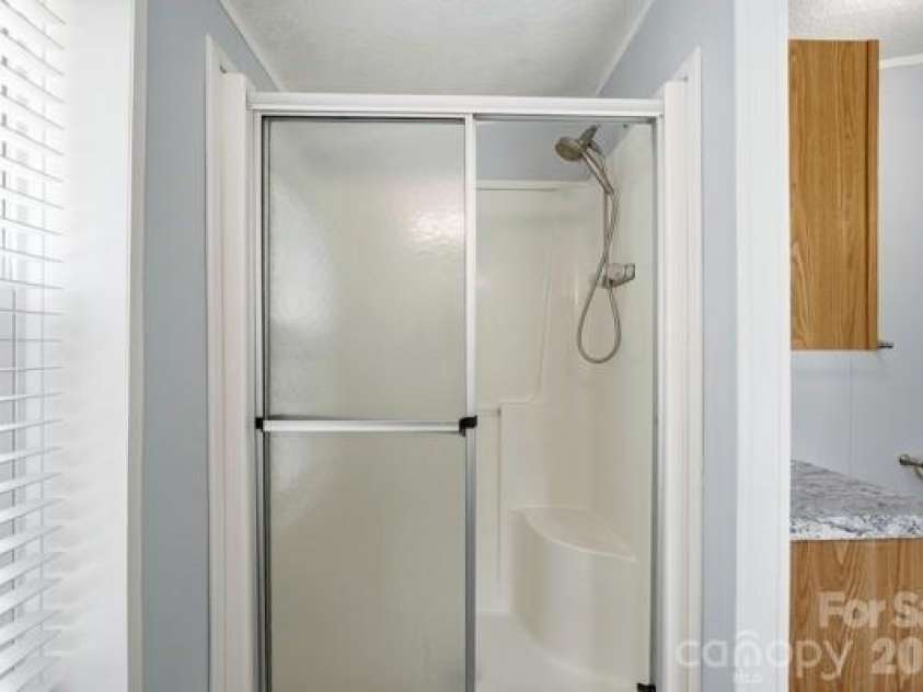 864 Stowe Lane, Gastonia, NC 28056.  MLS# CAR4385631, YatesRealty ID 30365. Primary bathroom shower