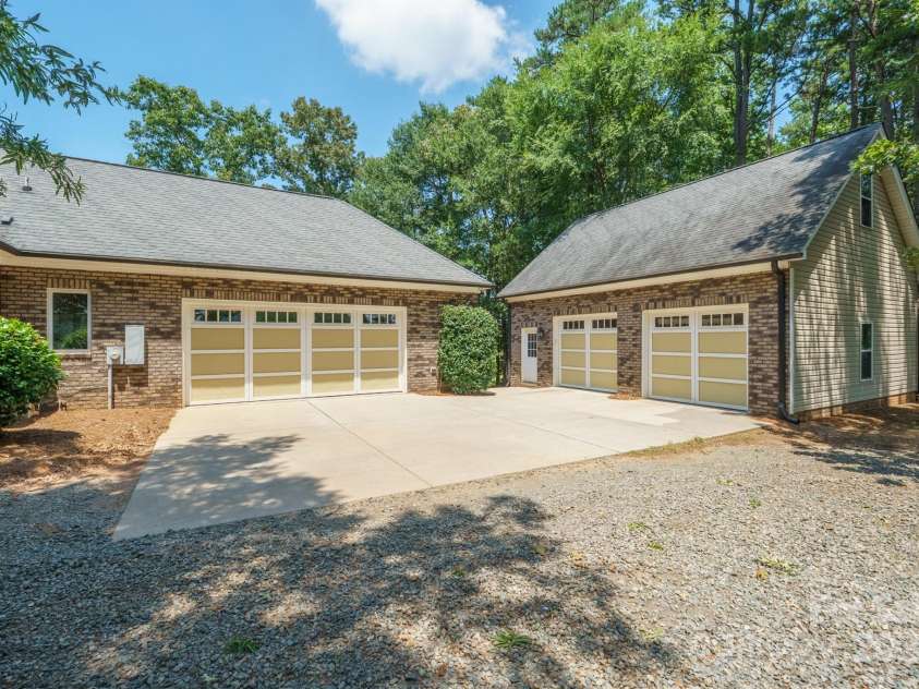 8304 Renee Ford Road, Stanfield, NC 28163.  MLS# CAR4281370, YatesRealty ID 30368. Do you have a car collection? 4 Garages total, plus the detached garage has walk up storage above!!