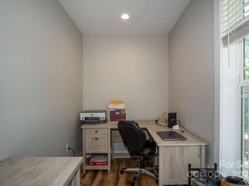50 Red Clover Lane, Pisgah Forest, NC 28768.  MLS# CAR4271803, YatesRealty ID 30371. Home office area on main level near front door