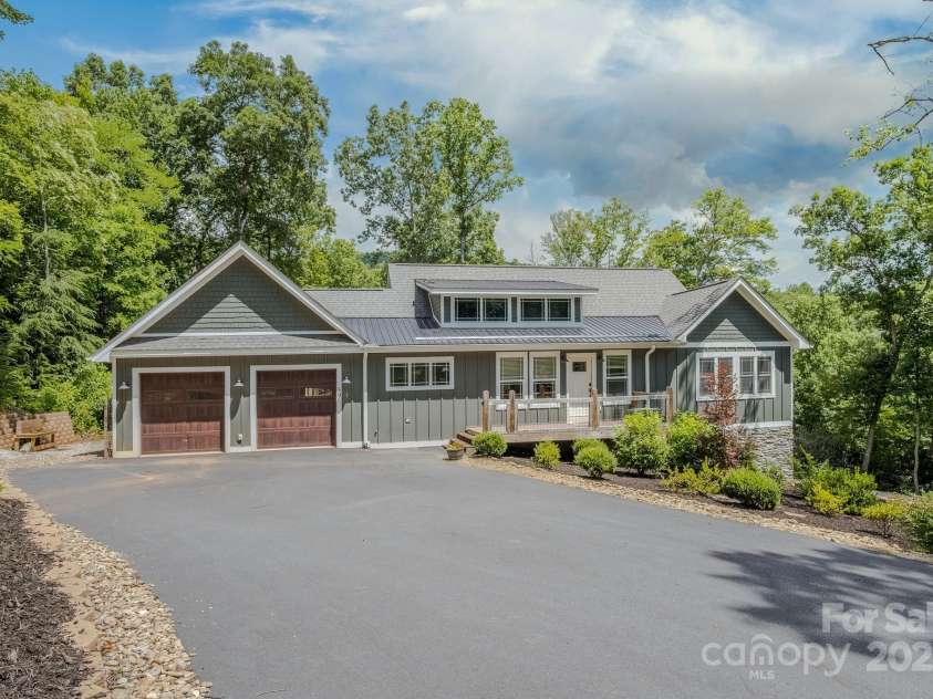 50 Red Clover Lane, Pisgah Forest, NC 28768.  MLS# CAR4271803, YatesRealty ID 30371. Large asphalt drive with side skirt and room beside garage to park car