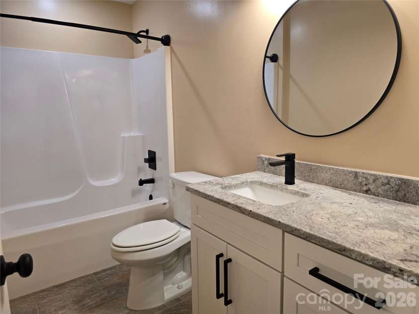 980 Smith Waldrop Road, Mill Spring, NC 28756.  MLS# CAR4393212, YatesRealty ID 30372. Guest Bath
