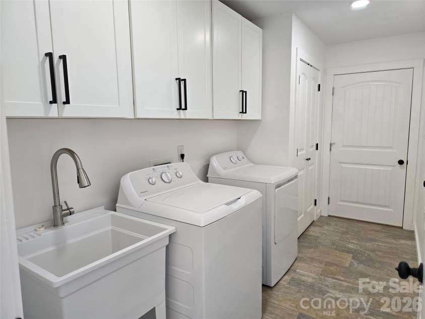 980 Smith Waldrop Road, Mill Spring, NC 28756.  MLS# CAR4393212, YatesRealty ID 30372. Large laundry