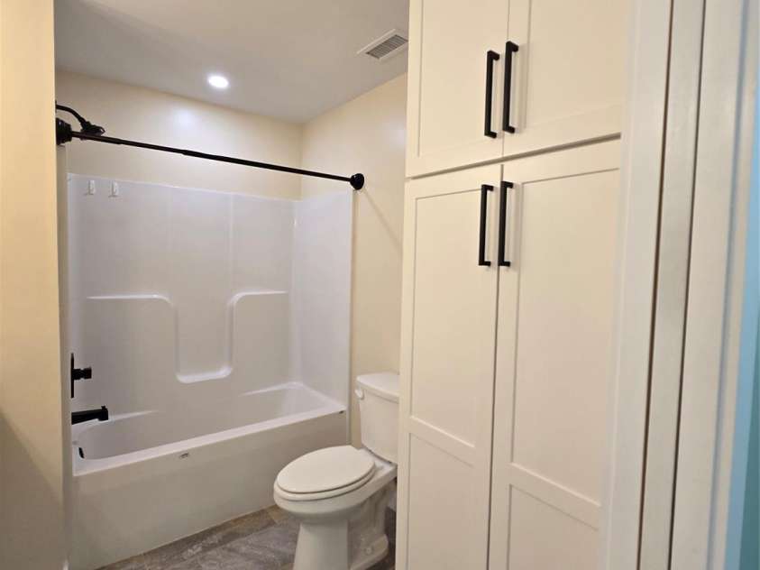 980 Smith Waldrop Road, Mill Spring, NC 28756.  MLS# CAR4393212, YatesRealty ID 30372. Primary Bath with large linen cabinet