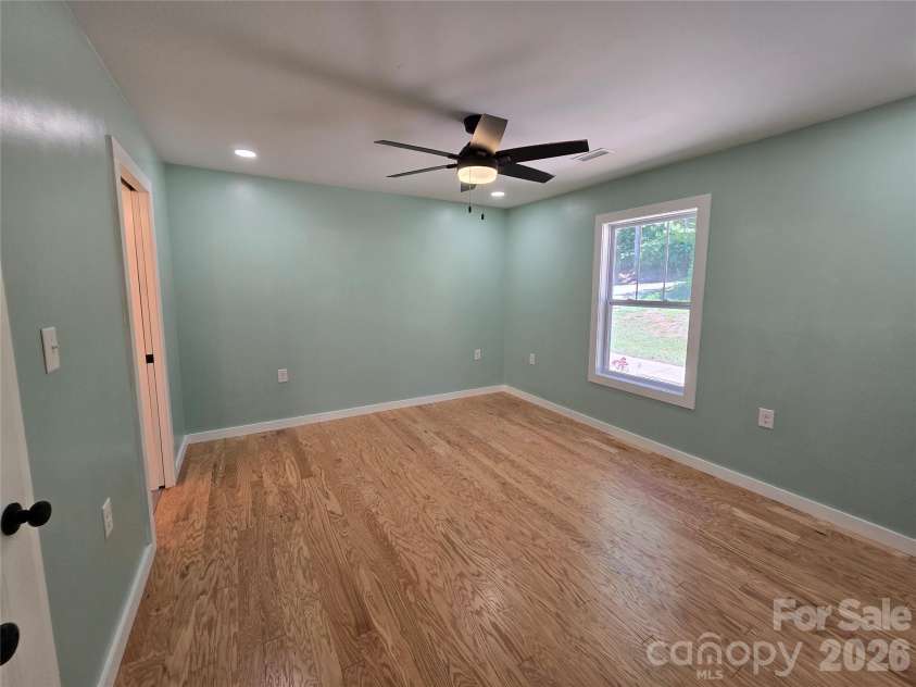 980 Smith Waldrop Road, Mill Spring, NC 28756.  MLS# CAR4393212, YatesRealty ID 30372. Primary Bedroom