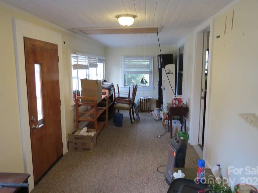155 6th Street, Taylorsville, NC 28681.  MLS# CAR4204136, YatesRealty ID 30373. Front porch enclosed patio area