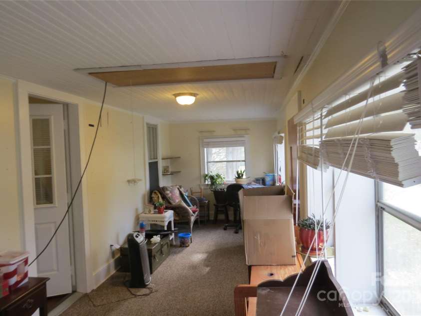 155 6th Street, Taylorsville, NC 28681.  MLS# CAR4204136, YatesRealty ID 30373. Front porch enclosed patio area