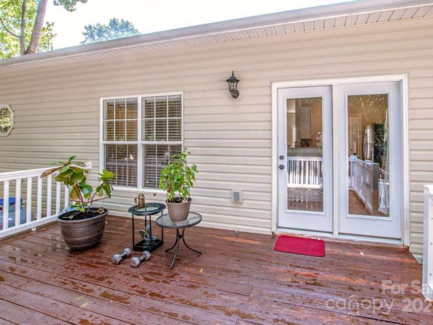 146 Valley Glen Drive, Troutman, NC 28166.  MLS# CAR4267527, YatesRealty ID 30375. Deck with new stain - repelling the rainwater.