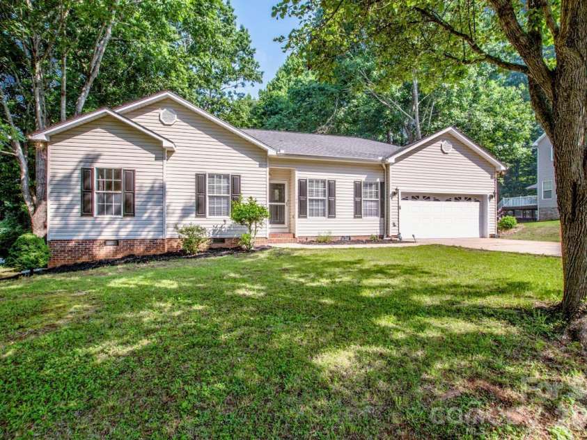 146 Valley Glen Drive, Troutman, NC 28166.  MLS# CAR4321225, YatesRealty ID 30375. Mature landscaping picture from summer