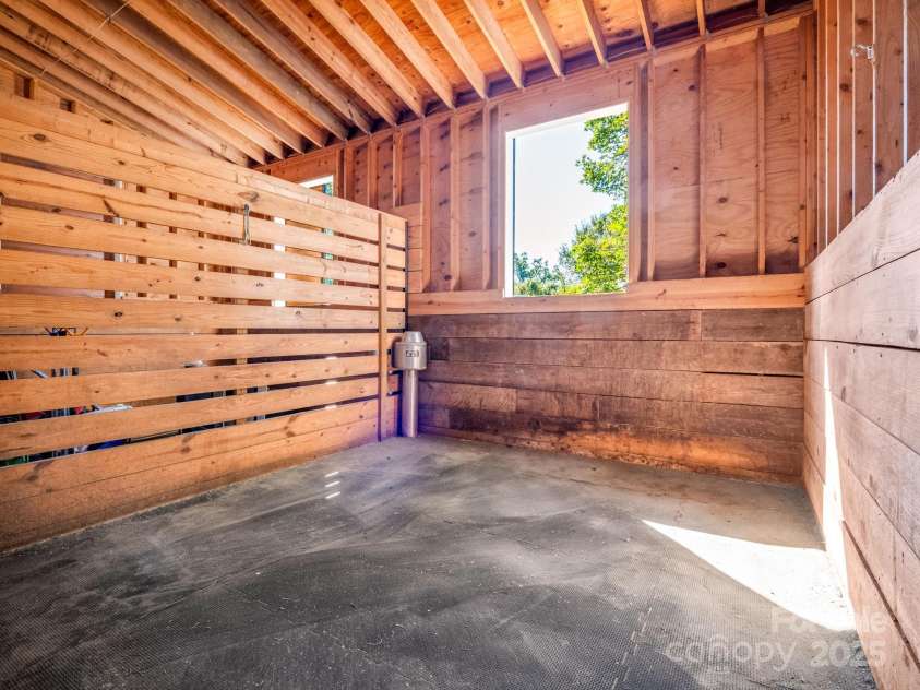 1050 Hunting Country Road, Tryon, NC 28782.  MLS# CAR4302671, YatesRealty ID 3038. Stall example with auto water system