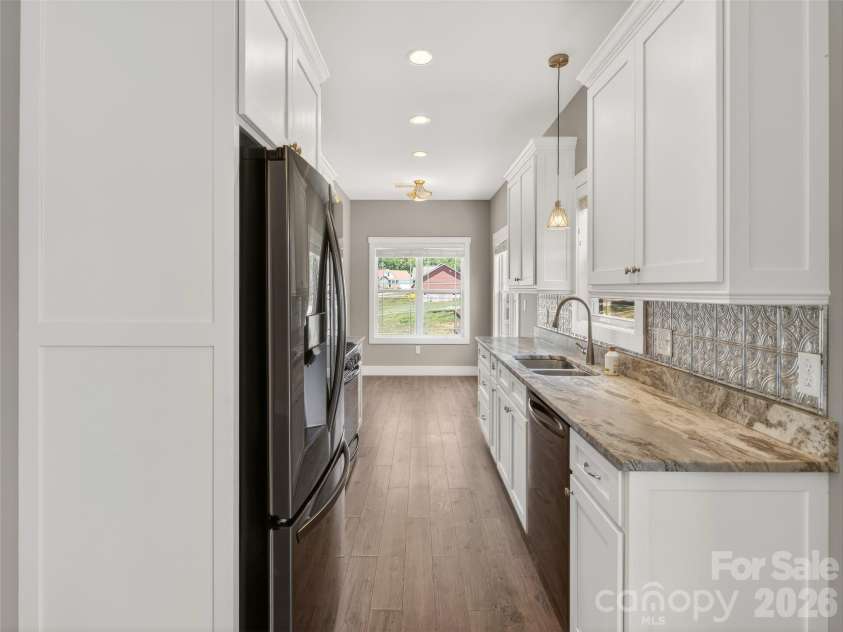 133 Asher Lane, Etowah, NC 28729.  MLS# CAR4383530, YatesRealty ID 30385. Gallery Kitchen with breakfast area.