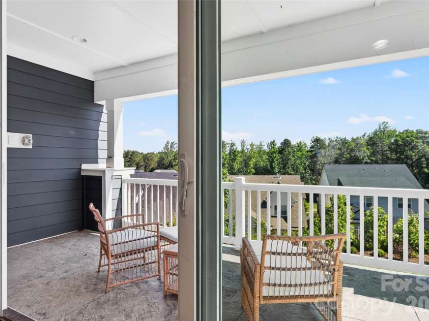106 Wesser Street, Davidson, NC 28036.  MLS# CAR4382368, YatesRealty ID 30388. Covered Balcony With A Tree-Top View