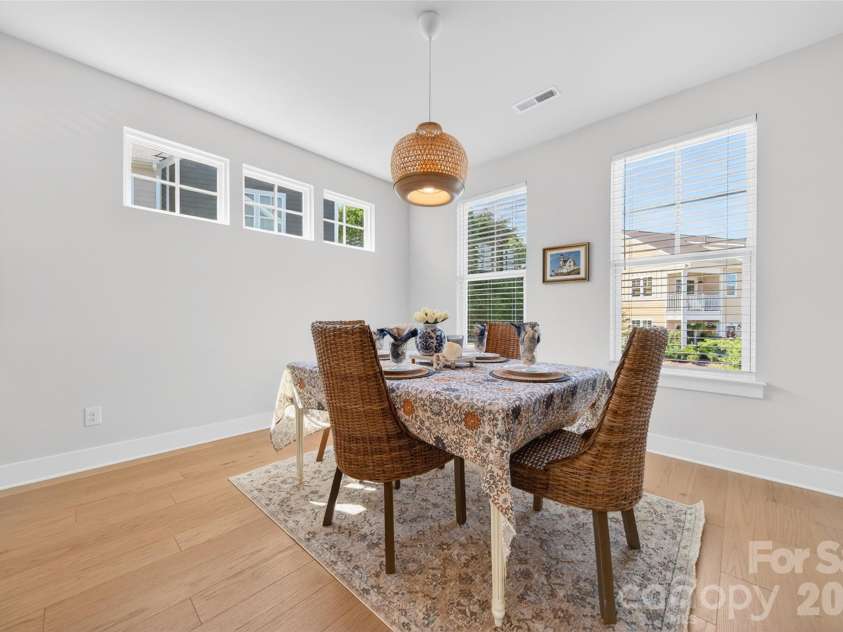 106 Wesser Street, Davidson, NC 28036.  MLS# CAR4382368, YatesRealty ID 30388. Dining Area With Updated Lighting