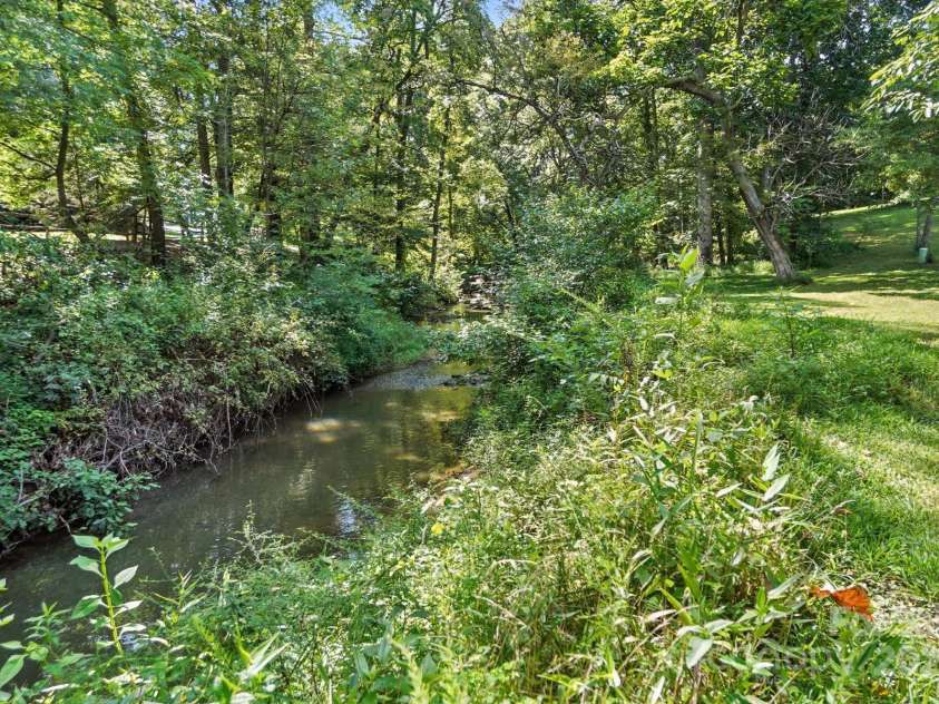 6649 Forney Hill Road, Denver, NC 28037.  MLS# CAR4287843, YatesRealty ID 30391. CREEK BED ON FRONT SIDE OF PROPERTY
