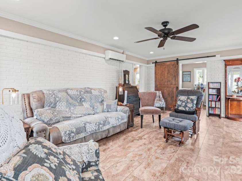 128 Killian Farm Road, Stanley, NC 28164.  MLS# CAR4288617, YatesRealty ID 30393. Barn door leading to laundry room