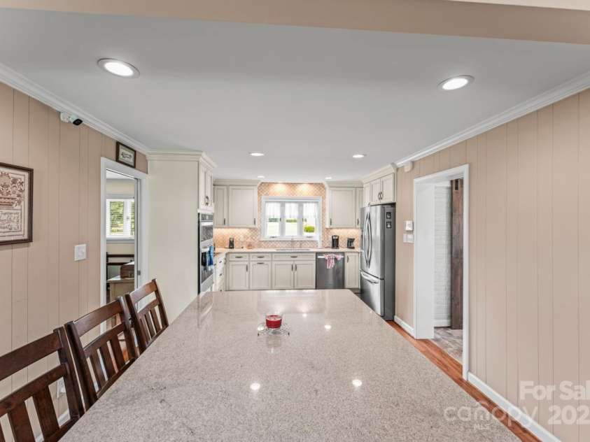 128 Killian Farm Road, Stanley, NC 28164.  MLS# CAR4288617, YatesRealty ID 30393. Conversations flow easily while cooking or sitting at the island